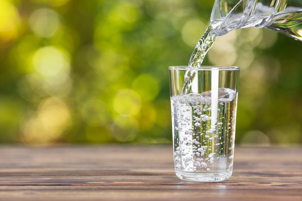 Pouring water into a glass.